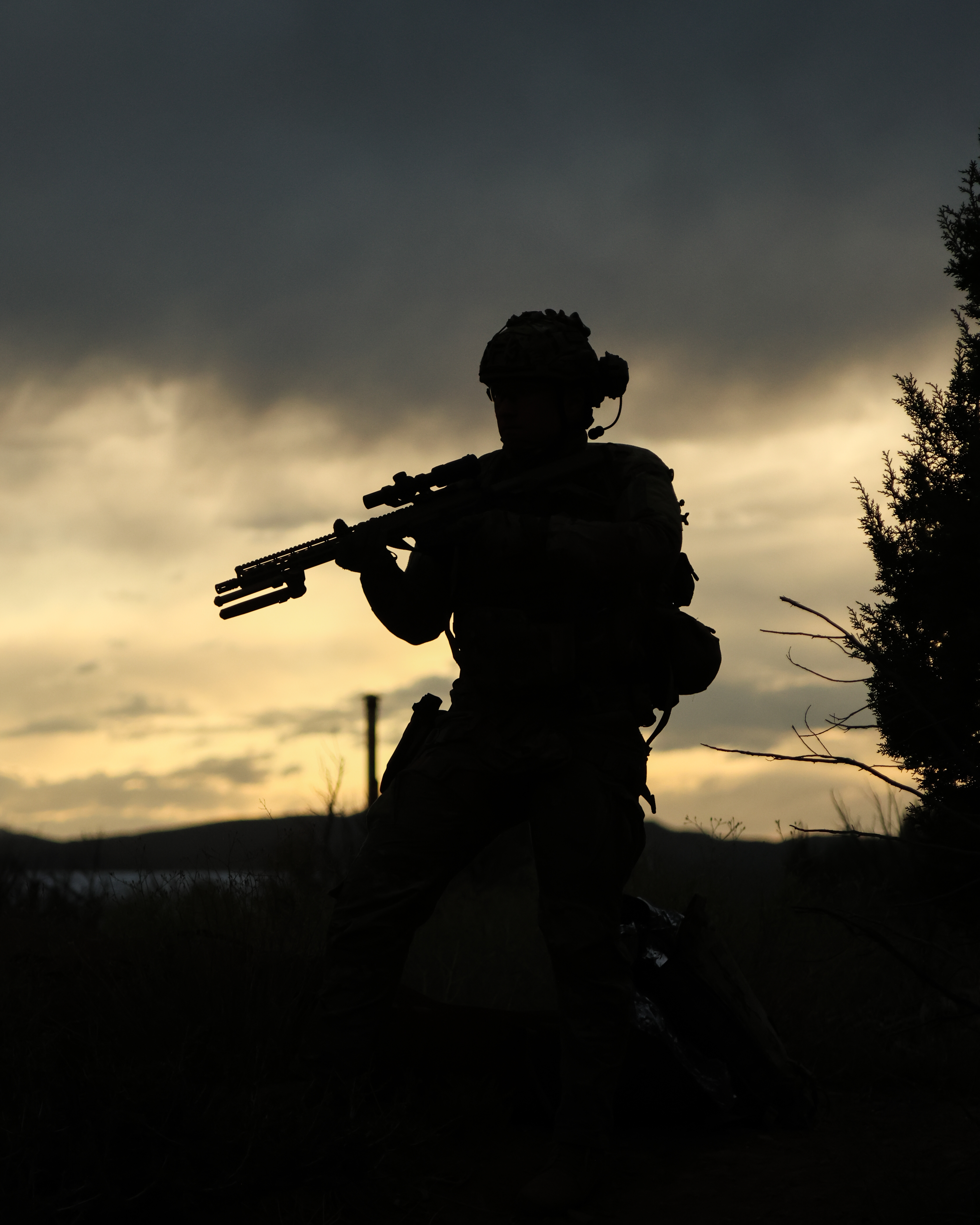 Tactical operator silhouette at sunset during Iron Rescue training